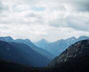 mountains under cloudy skies
